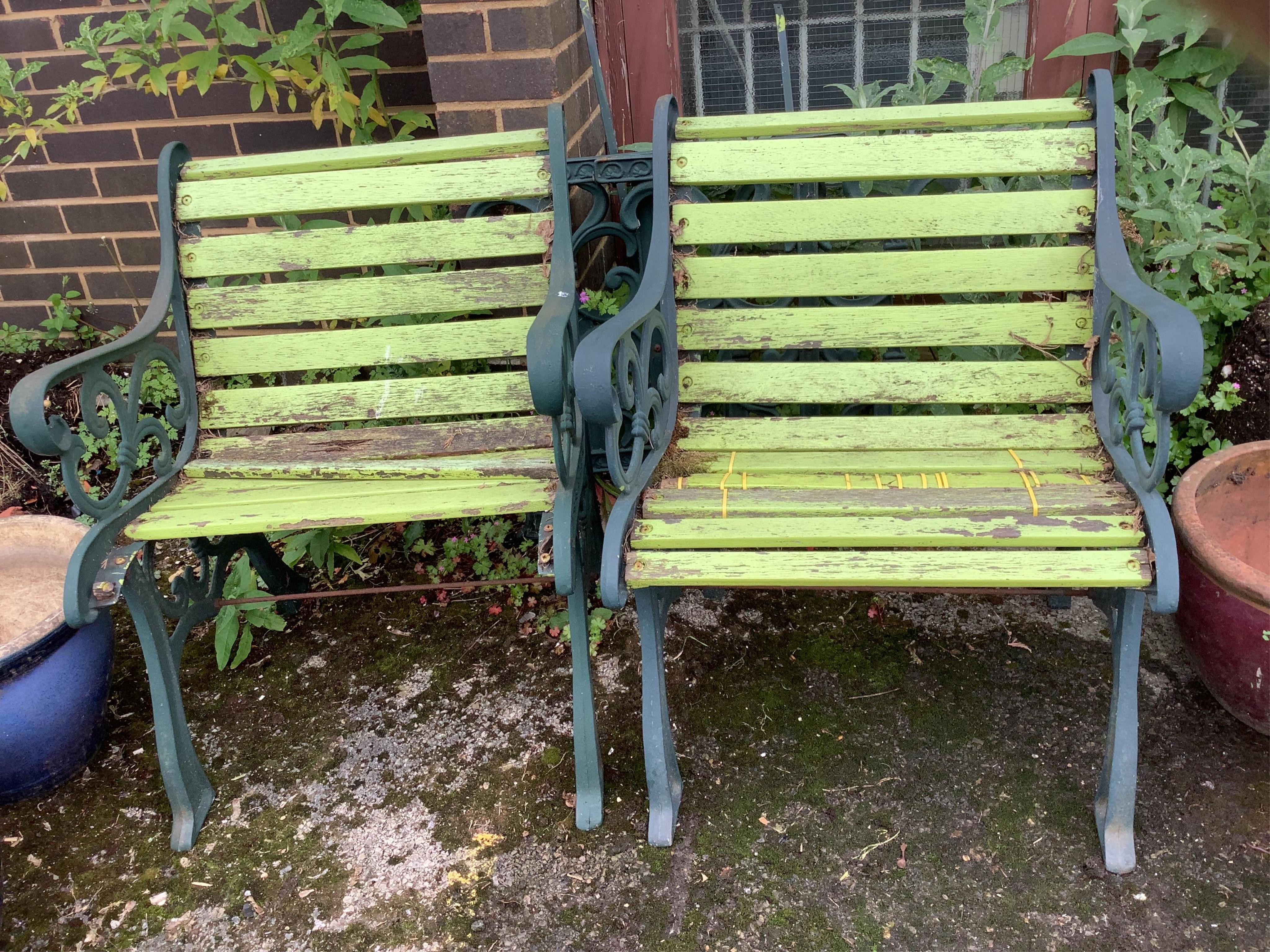 A Victorian style painted aluminium slatted wood three piece garden suite, bench width 128cm, depth 60cm, height 76cm